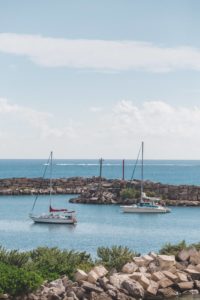 three sail boat in cancun marina